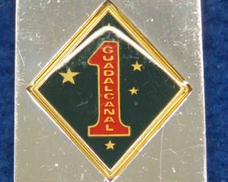 Lot 208. Franklin Mint's sterling silver 1st marine Division U.S.A. ingot from "The World's Greatest Regiments" weighing 23.14 grams.. All 50 emblems and the wooden display case will be sold separately in this auction