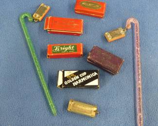 Lot 169. Three novelty harmonicas and four empty harmonica boxes including My Little Charmer and box from F.A. Rauner
