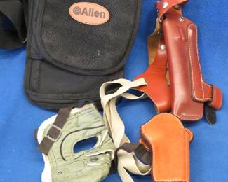 Lot 358. Two leather holsters, and Allen shooting accessories bag, and more