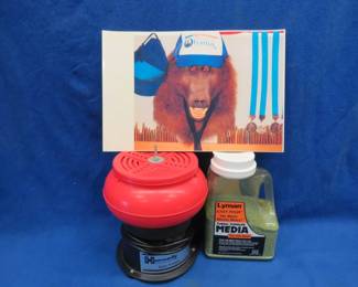 Lot 394. Hornady case tumble and a container of media