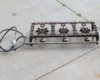 Lot 195. Vintage cast iron Griswold 713 three-burner gas stove