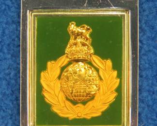 Lot 157. Franklin Mint's sterling silver The Royal marines United Kingdom ingot from "The World's Greatest Regiments" weighing 22.77 grams.. All 50 emblems and the wooden display case will be sold separately in this auction