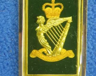 Lot 109. Franklin Mint's sterling silver The Royal Irish Rangers United Kingdom ingot from "The World's Greatest Regiments" weighing 23.63 grams.. All 50 emblems and the wooden display case will be sold separately in this auction