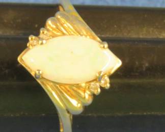 Lot 267. Woman's opal cocktail ring size 9. Marked 14K CID ( Clyde Duneier)