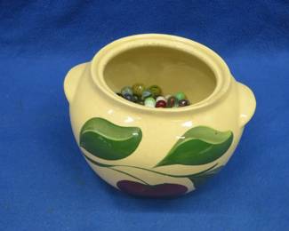 Lot 371. Lidless apple cookie jar pot with marbles.