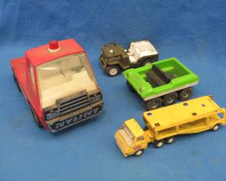 Lot 40. Tonka toy trucks and more: Tonka car hauler. Tonks 6-wheel dune buggy. Tonka Jeep. Nylint cab/tractor