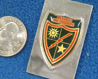 Lot 259. Franklin Mint's sterling silver 475th Infantry Regiment U.S.A. ingot from "The World's Greatest Regiments" weighing 23.49 grams.. All 50 emblems and the wooden display case will be sold separately in this auction
