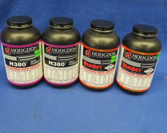 Lot 218. Three 1-pound containers of Hodgdon gunpowder and one empty container