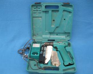 Lot 431. Makita 9.6 volt battery-operated drill with 2 batteries, charger, and bits.