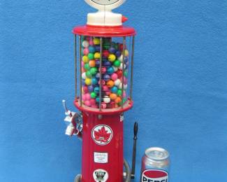 Lot 26. Reproduction of a circa 1920s gas pump gumball machine. Light at the top works. Gumball dispensing mechanism needs repair.