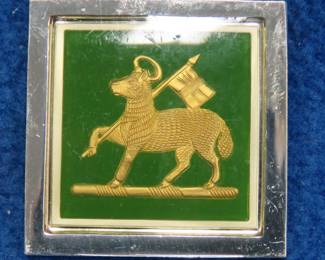 Lot 105. Franklin Mint's sterling silver The Queen's Royal Regiment United Kingdom ingot from "The World's Greatest Regiments" weighing 14.70 grams.. All 50 emblems and the wooden display case will be sold separately in this auction