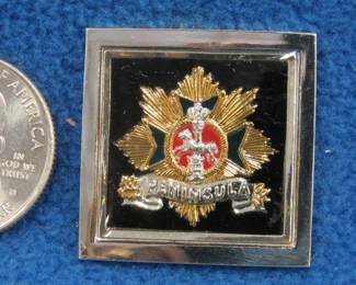 Lot 253. Franklin Mint's sterling silver Brunswick Infantry Regiment No. 92 Germany ingot from "The World's Greatest Regiments" weighing 15.09 grams.. All 50 emblems and the wooden display case will be sold separately in this auction
