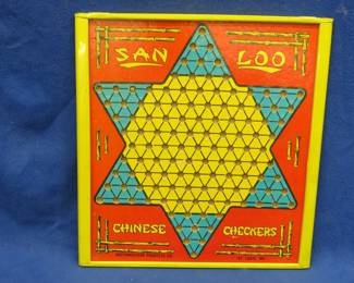 Lot 124. Vintage Chinese Checkers and Checkers game with marbles stored in the sides