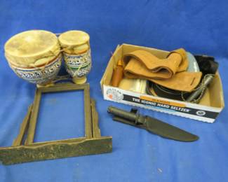 Lot 363. Double terra cotta bongo drums, knife and sheath, swivel picture frame, two game calls (one works), and more