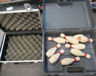 Lot 146. Two cases and nine bowling pins