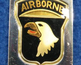 Lot 206. Franklin Mint's sterling silver 101st Airborne Division U.S.A. ingot from "The World's Greatest Regiments" weighing 23.16 grams.. All 50 emblems and the wooden display case will be sold separately in this auction