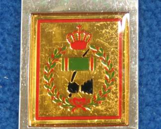 Lot 52. Franklin Mint's sterling silver 1st Tank Regiment Jordan ingot from "The World's Greatest Regiments" weighing 22.72 grams.. All 50 emblems and the wooden display case will be sold separately in this auction