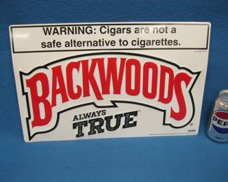 Lot 228. Backwoods Cigars metal sign. 17" x 11".