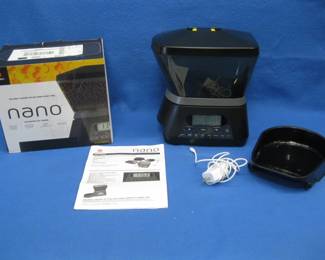 Lot 397. Nano automatic pet feeding station. Appears to be unused.