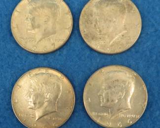 Lot 28. Four 40% silver Kennedy half dollars