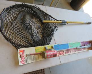 Lot 334. Rubber fish landing net and a NIP Coca-Cola fishing rod and reel