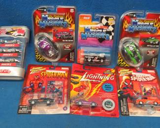 Lot 71. NIP collectible cars: Three 1:64 Muscle Machines. Three Johnny Lightening. One pack of three Hot Wheels cars