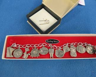 Lot 264. Sterling silver MN charm bracelet, and an untested stone