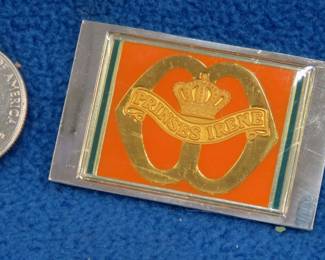 Lot 252. Franklin Mint's sterling silver Fusilier Guards "Princess Irene" Netherlands ingot from "The World's Greatest Regiments" weighing 23.05 grams.. All 50 emblems and the wooden display case will be sold separately in this auction