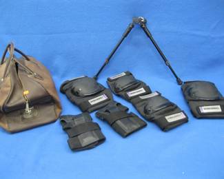 Lot 191. Gear used by a long-range rifle shooter. Knee and elbow pads with a bipod and carrying bag.
