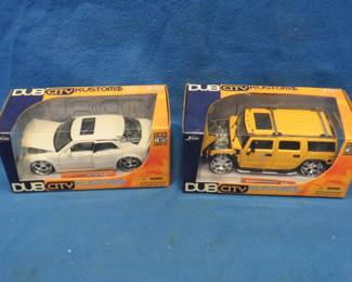 Lot 74. Two "Dub City Kustom$" 1:24 cars: Hummer H2. Chrysler 300C
