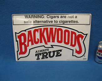 Lot 25. Backwoods Cigars metal sign. 17" x 11".