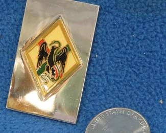 Lot 258. Franklin Mint's sterling silver 1st Foreign Regiment France ingot from "The World's Greatest Regiments" weighing 23.47 grams.. All 50 emblems and the wooden display case will be sold separately in this auction