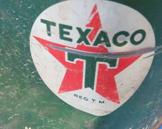 Lot 344. About 20 lbs. of Texaco grease in a dented Texaco can along with an old gas can