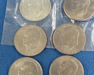 Lot 118. Six Eisenhower Dollar coins including one that is uncirculated