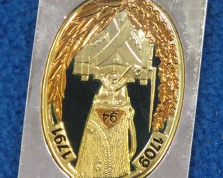 Lot 151. Franklin Mint's sterling silver 94th Infantry Regiment France ingot from "The World's Greatest Regiments" weighing 23.37 grams.. All 50 emblems and the wooden display case will be sold separately in this auction