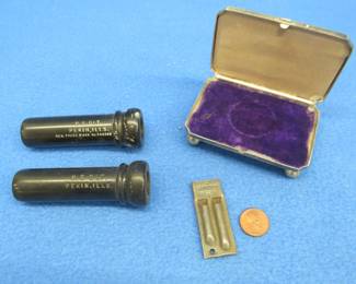 Lot 18. Very early Cracker Jack tin whistle, Old duck call parts, and a silverplate watch box.