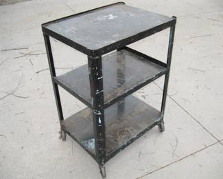 Lot 314. Three-tiered rolling metal stand. 33" X 24" X 18".