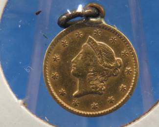 Lot 307. 1851 Liberty Head Type 1 gold dollar with 90% gold and a total weight of 1.672 grams