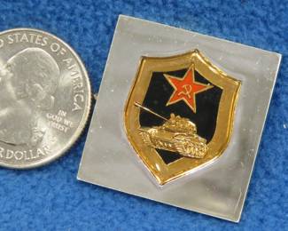 Lot 255. Franklin Mint's sterling silver The Tank Corps Soviet Union ingot from "The World's Greatest Regiments" weighing 14.43 grams.. All 50 emblems and the wooden display case will be sold separately in this auction
