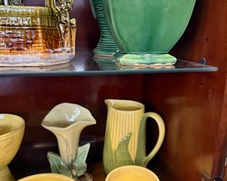 Tons of McCoy pottery , Roseville pottery , Hull pottery , Shawnee Pottery