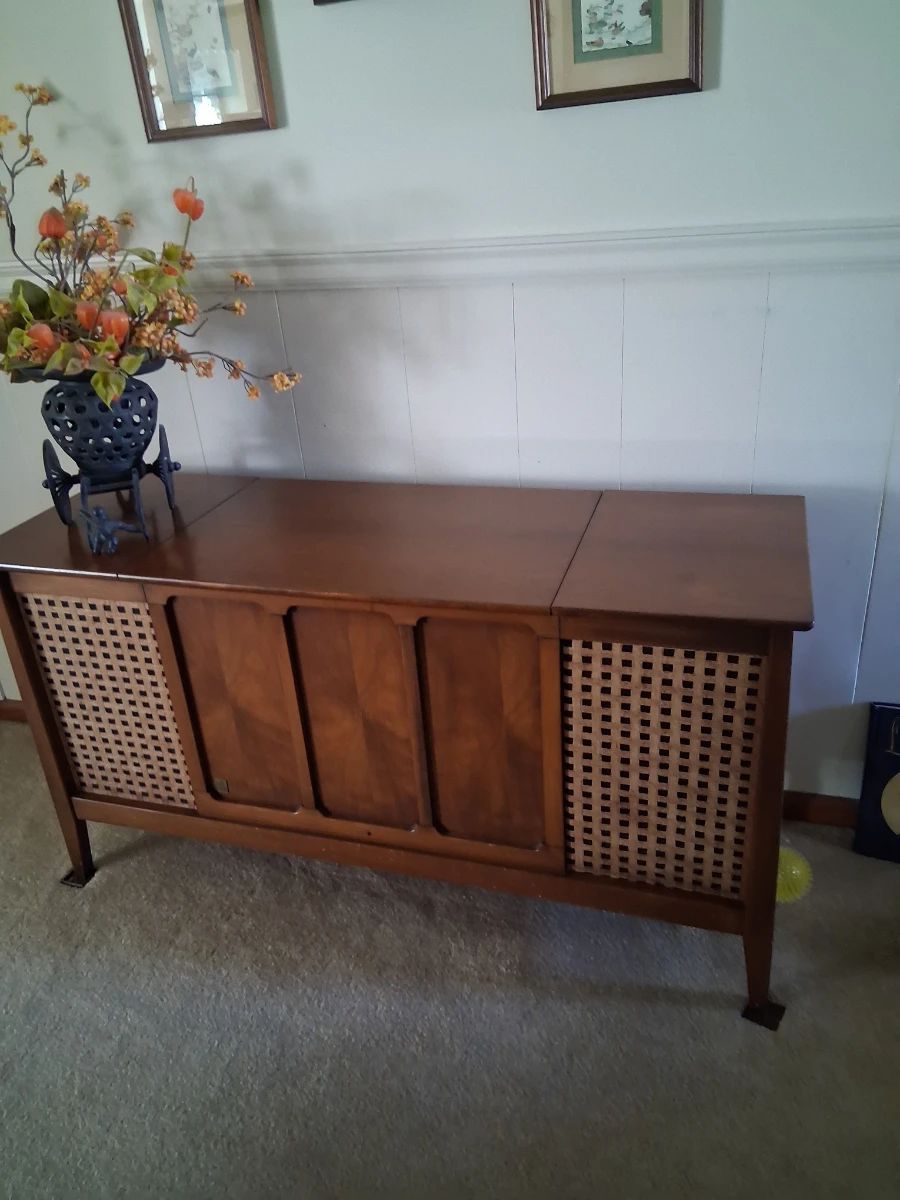 MCM stereo cabinet . The radio on it still works but the turntable does not . It is in good condition and looks beautiful whether you use the stereo or not.