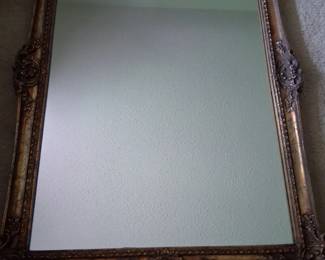 Large beautiful gold gilded mirror .