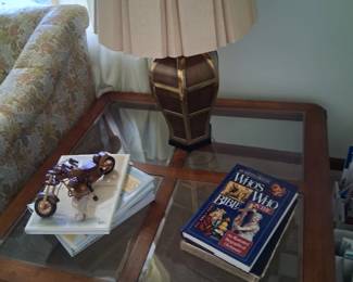 This is the square coffee table that is also in that group . It has 4 glass panes and is 3 ft square, All 4 pieces of this group are being sold separately. Like the octagonal table there is not a bottom shelf.