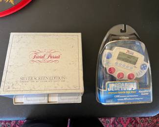 Trivial Pursuit Silver Screen question decks and handheld Jeopardy game