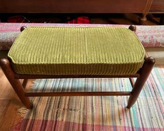 Vintage wooden footstool iwth green corderoy seat cushion