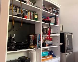 Books, bookshelves, and cameras