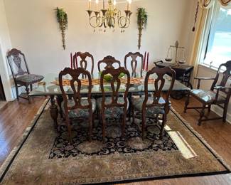 Antique table with beveled glass top and matching chairs