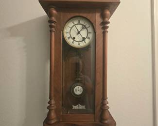 Vintage pendulum wall clock with winding key