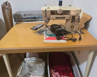 Singer sewing machine and fold-up sewing table