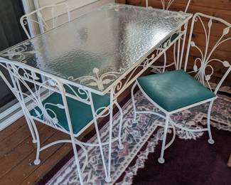 Metal table with 4 padded chairs